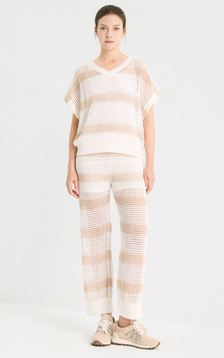 White open-knit V-neck top with tan sequined horizontal stripe bands and short sleeves
