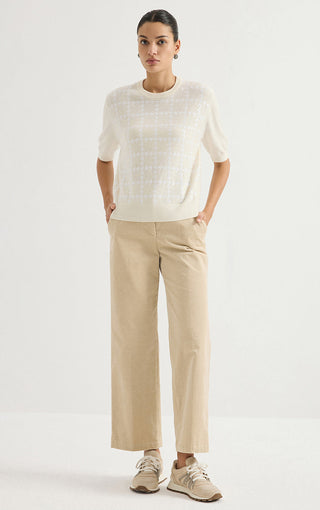 Ivory cashmere houndstooth short-sleeve sweater on model
