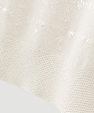 Close-up of white cashmere knit with subtle houndstooth texture
