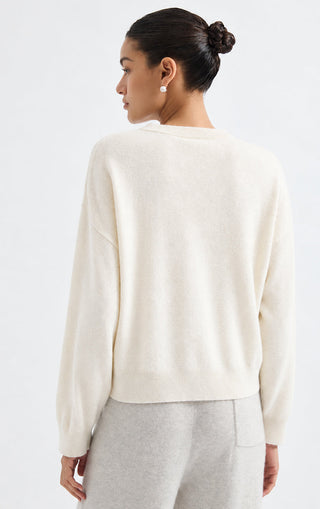 Back view of white cashmere crewneck sweater with allover sequin detail
