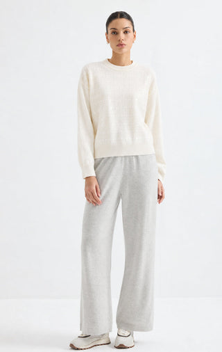 White cashmere crewneck sweater with allover sequin sparkle, ribbed hem
