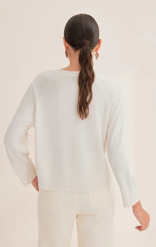 White cashmere knit sweater back view, ribbed cuffs and straight hem