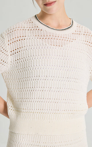 Ivory white linen sequin open-knit short sleeve top close-up with black-edged crew neck