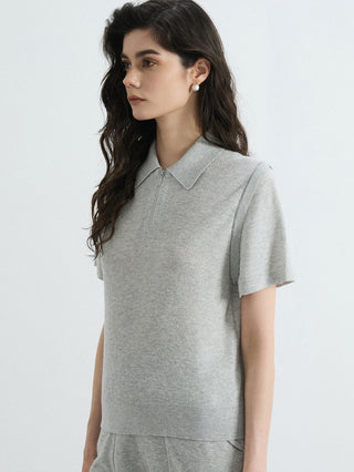 Gray half-zip polo knit top with short sleeves and ribbed collar