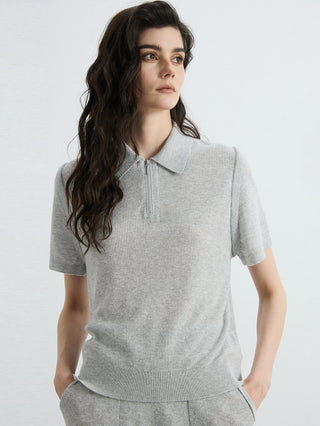 Gray half-zip polo knit top with turn-down collar and vertical zip detail