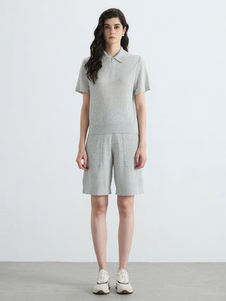 Gray half-zip polo knit top with ribbed knit texture and short sleeves