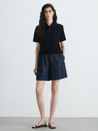Black half-zip polo knit top, short sleeves and textured ribbed knit front