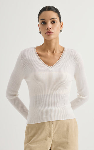 White ribbed wool V-neck sweater with long sleeves, front view.