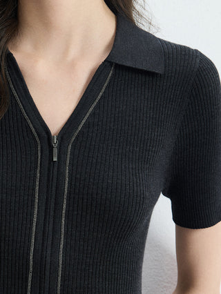 Close-up of black ribbed wool-silk full-zip polo knit top with contrast zipper trim