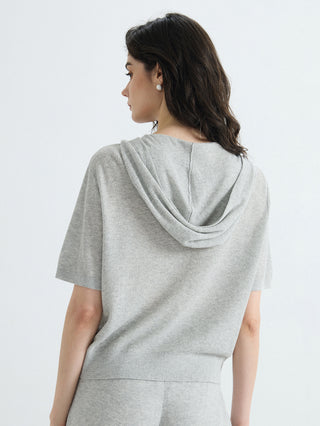 Gray ribbed hooded zip-up top, back view showing hood and short sleeves.