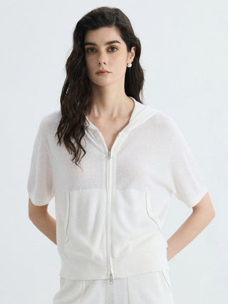 Ivory linen-silk ribbed hooded zip-up top with short sleeves and front pockets.