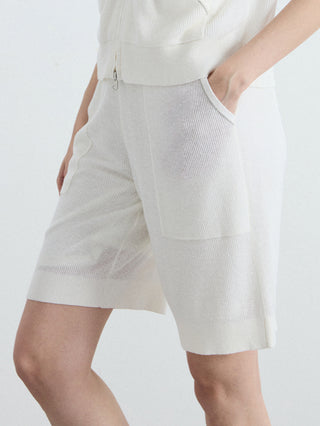 White relaxed ribbed knit shorts with slanted cargo pockets and drawcord waist