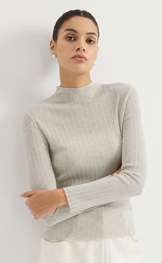Light gray ribbed knit turtleneck sweater, long sleeves and fitted waist hem