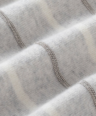 Light grey cashmere sweater with light striped bands and bead-like trim at neckline