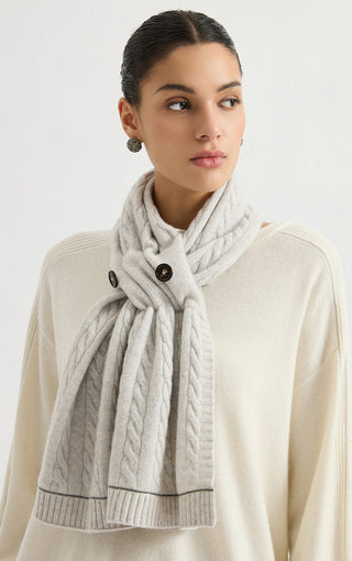 Light gray cashmere cable-knit button scarf with braided cable texture and fringed hem