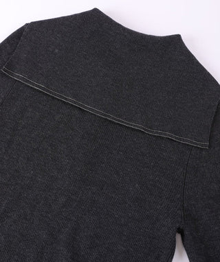 Black wool polo knit detail: back yoke seam and ribbed neckline
