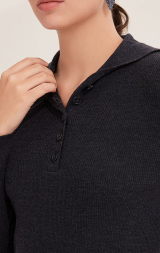 Black wool polo knit close-up: ribbed collar and button placket