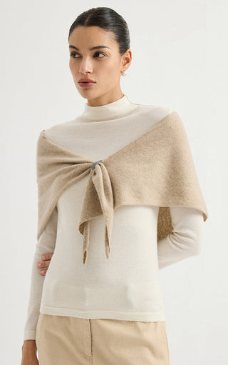 Camel cashmere triangle wrap, draped over shoulders with tied front ends