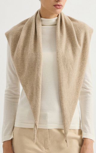 Camel cashmere triangle wrap with long tie ends, draped open at the neckline