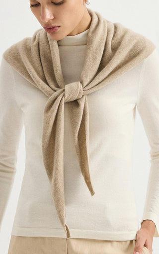 Camel cashmere triangle wrap, knotted at chest with narrow hanging tie ends