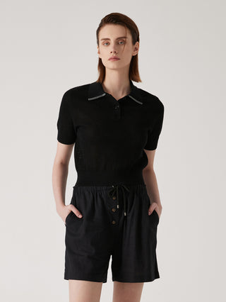 Black knit polo-neck top with beaded-trim collar, short sleeves, and ribbed hem.