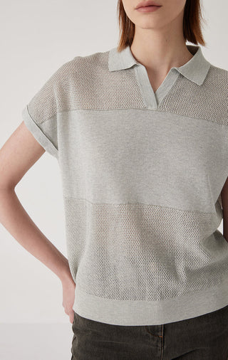 Light gray polo knit top close-up: collared neckline with button placket
