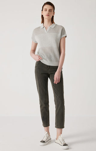 Light gray polo knit top with short sleeves and collared neckline; relaxed fit