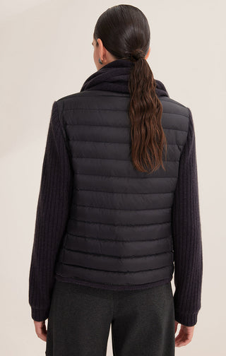 Back view of black down knit jacket with horizontal quilting and ribbed knit sleeves