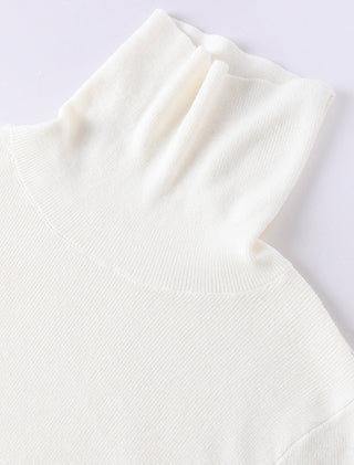 White ribbed turtleneck sweater knit, close-up of collar and upper chest