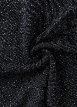 Black knit fabric close-up with metallic stripe along the seam