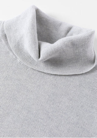 Light gray turtleneck knit sweater close-up of folded collar and ribbed texture
