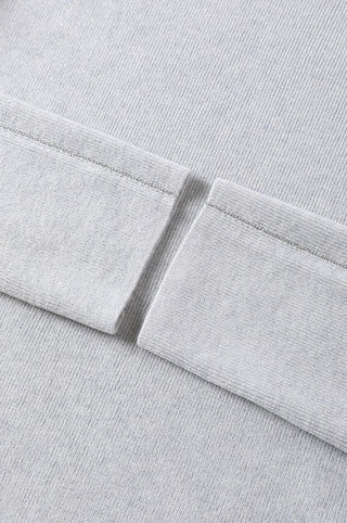 Light gray sweater hem and sleeve cuff detail in fine rib knit