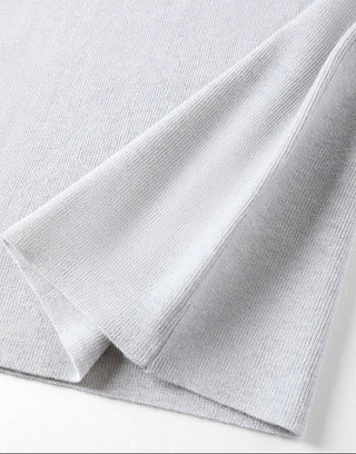 Light gray knit sweater cuff and side seam finish