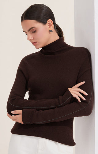 Dark brown turtleneck sweater with metallic piping along side seams