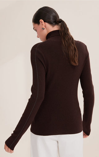 Back view: dark brown turtleneck sweater with metallic side seam accents