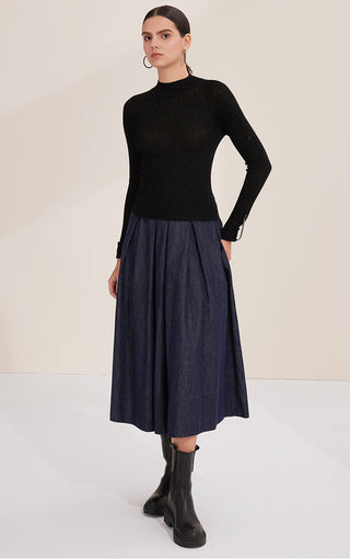 Black fitted knit mock-neck top with long sleeves and ribbed waist hem