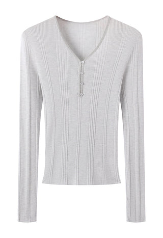 White wool-blend v-neck knit top with beaded placket and button placket detail