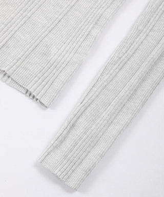 White knit top sleeves and hem, ribbed cuffs and clean straight hemline
