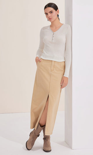 White wool-blend V-neck knit top with beaded button placket, fitted long sleeves
