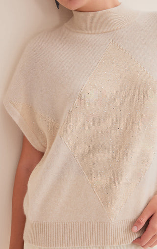 Camel cashmere knit close-up: ribbed hem, diamond sequin pattern, short sleeves