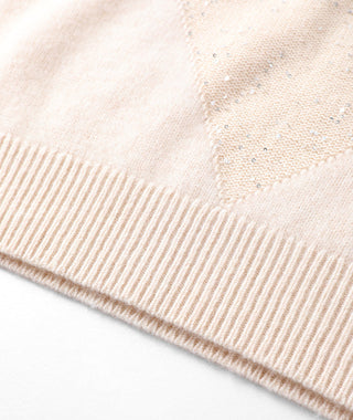 Camel cashmere sweater hem ribbing close-up with dotted sequin detail