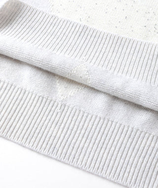 Light gray cashmere short-sleeve knit sweater hem with ribbed knit texture