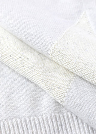 Light off-white cashmere short-sleeve knit sweater cuff and textured knit detail