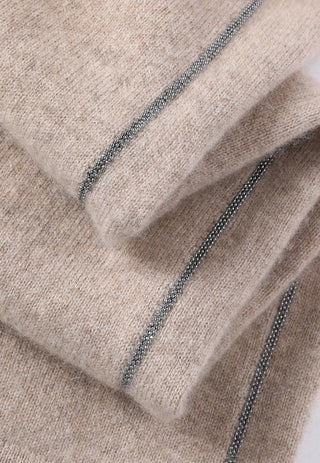 Close-up of beaded side seam trim on camel cashmere knit pants