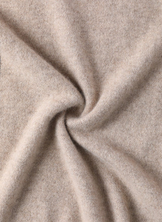 Camel cashmere knit fabric close-up with smooth drape texture