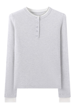 Light gray henley top flat lay showing ribbed knit and short button-front placket