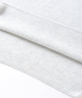 Light gray fine ribbed fabric texture with folded knit hem edge