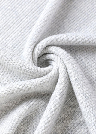Light gray ribbed wool-blend henley top with beaded neckline detail, close-up