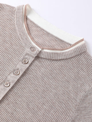 Close-up of taupe henley neckline with three visible buttons and ribbed collar trim