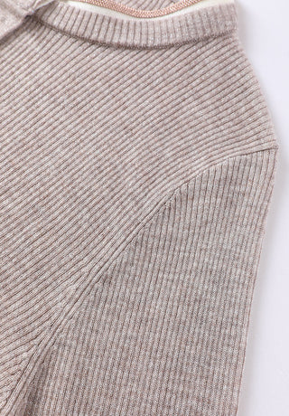 Rib-knit sleeve detail on taupe henley top with subtle texture and seam finish